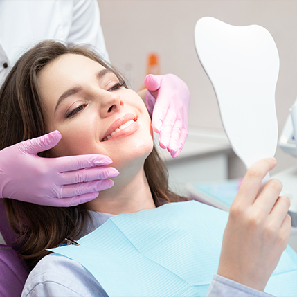 Dentist describing virtual smile design process to cosmetic dentistry patient