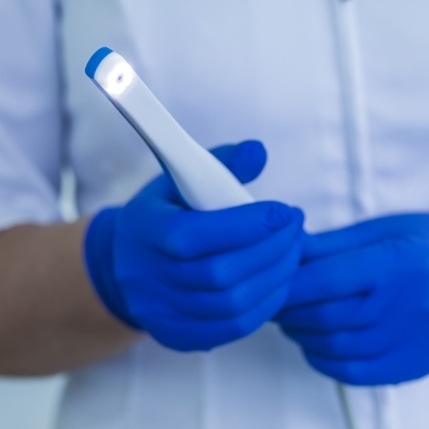 Dentist holding an intraoral camera