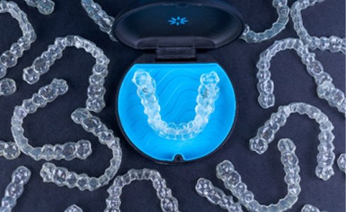 Invisalign aligners in storage case with other clear aligners