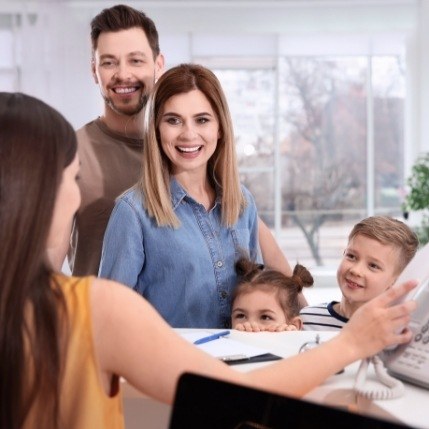 Dental patients discussing the cost of Invisalign