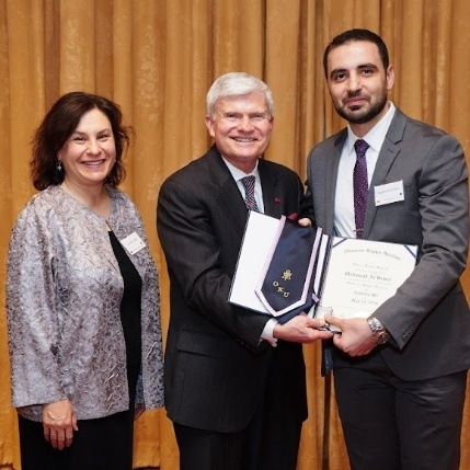 Doctor Homsi receiving diploma