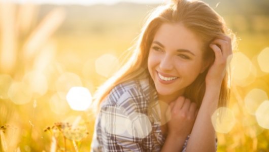 Woman with healthy smile after preventive dentistry