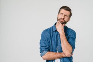 Man wearing curious expression