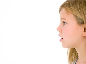 Side profile view of a child breathing through her mouth 